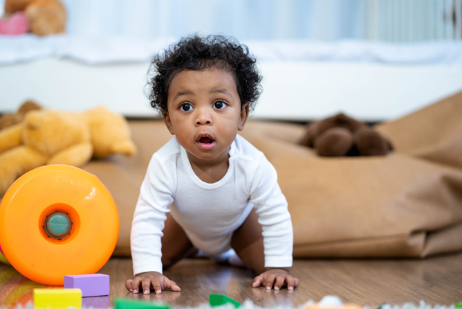 Baby crawling on floor