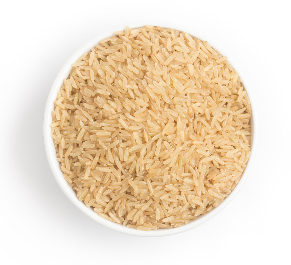 Bowl filled with uncooked whole grain rice