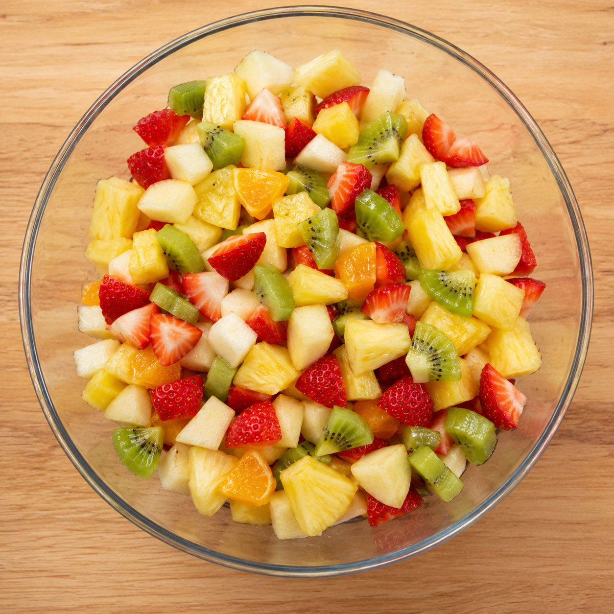 Chopped mixed fruit in a glass bowl